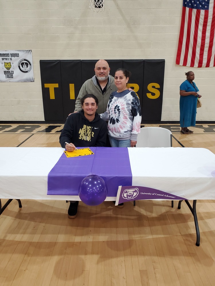 Student Signing With Family